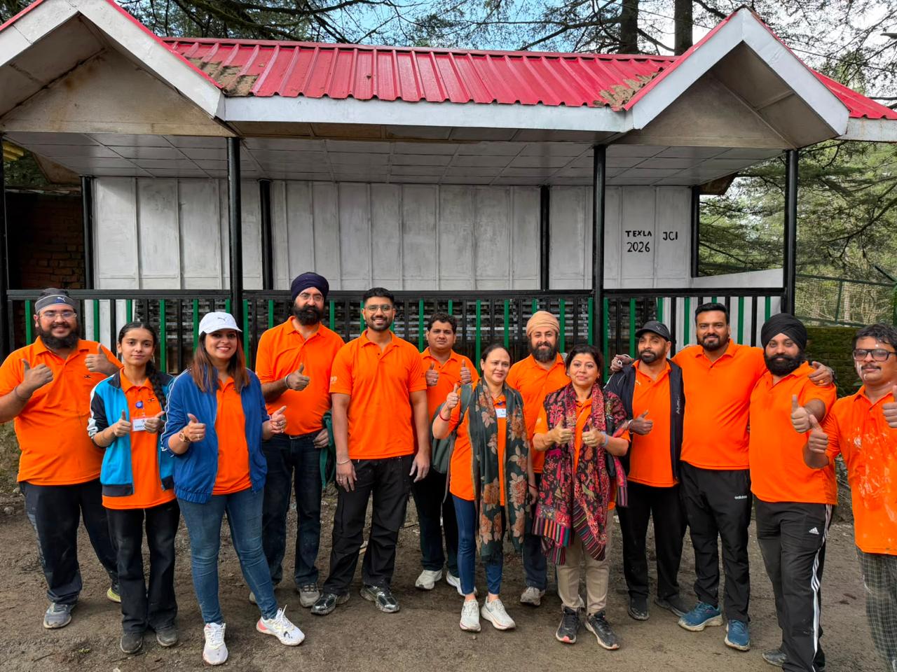 The orange Texla group together after service work