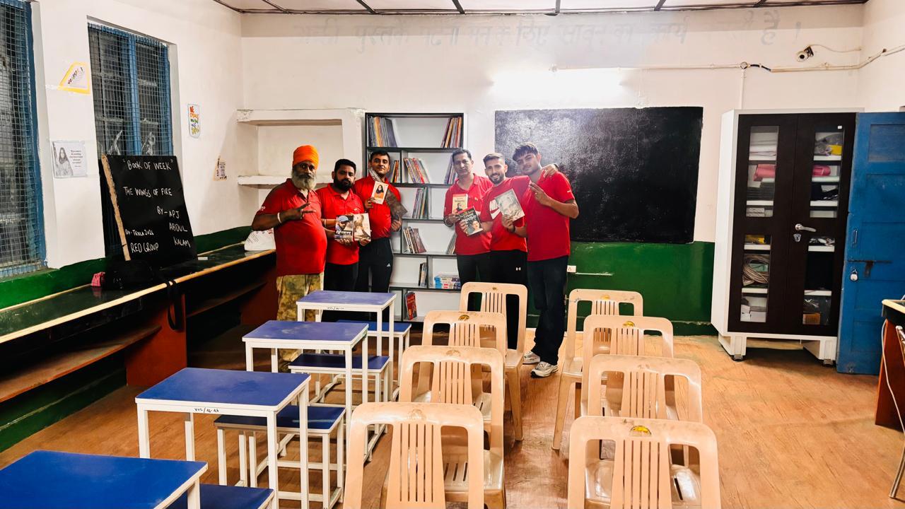 Texla participants presenting books in a classroom